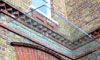 Minimalist cantilever glass canopy in Wimbledon, London